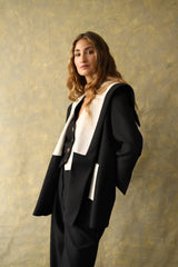 Veste en laine noire et blanche